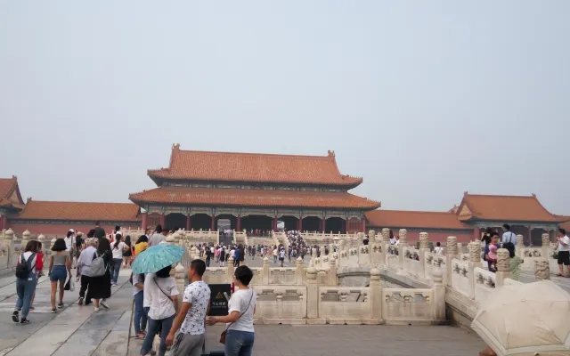 Crowds crossing the marble bridges toward the Gate of Supreme Harmony in the Forbidden City